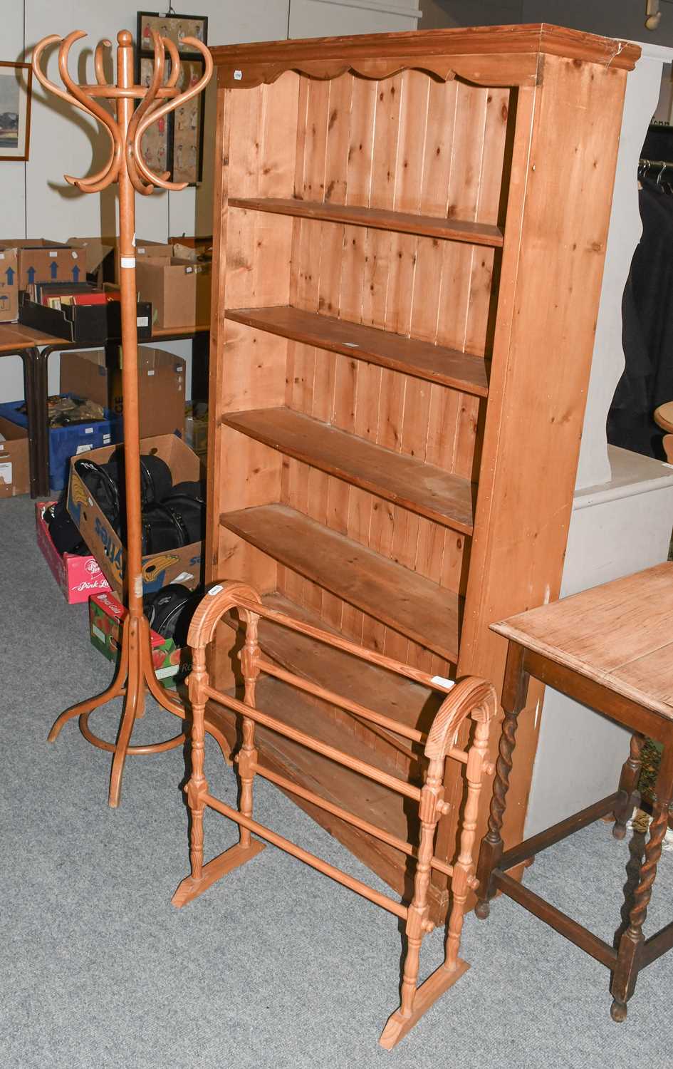 A Pine Open Bookcase, 106cm by 26cm by 180cm; together with a coat stand and a towel rail (3)