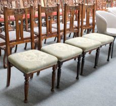 A Set of Four Mahogany Arts and Crafts Side Chairs, with stylised cut out splat and turned legs