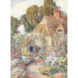 Howard Neville Walford (1864-1950) A cottage garden scene Signed, watercolour heightened with white;