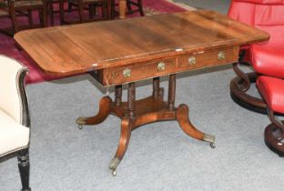 A Regency Brass Inlaid Rosewood Drop Leaf Sofa Table, on turned supports and downswept legs, 145cm