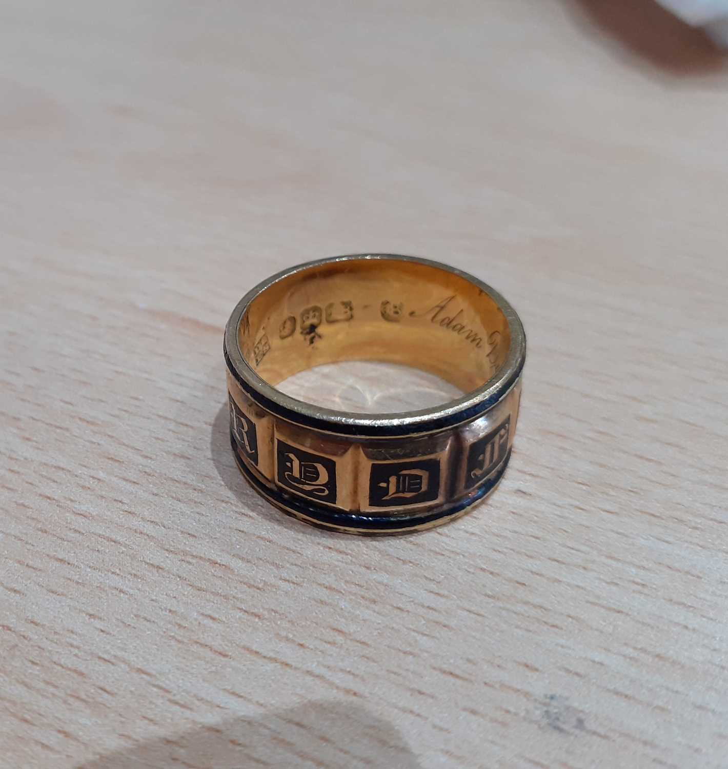 An 18 Carat Gold Enamel Mourning Ring the yellow broad band enamelled in black to read IN MEMORY OF, - Image 3 of 7