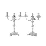 Two George III Silver Two-Light Candleabra, One Base by Ebenezer Coker, London, 1760, The Other Bas