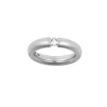 A Platinum Diamond Solitaire Ring the round brilliant cut diamond in a tension setting, to a plain