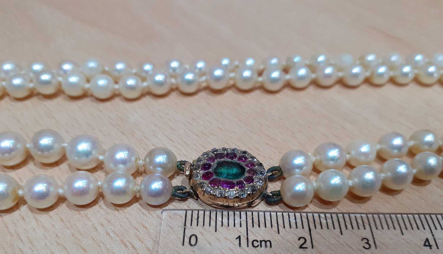 A Two Row Cultured Pearl Necklace, with An Emerald, Ruby and Diamond Cluster Clasp the 66:63 - Image 3 of 5