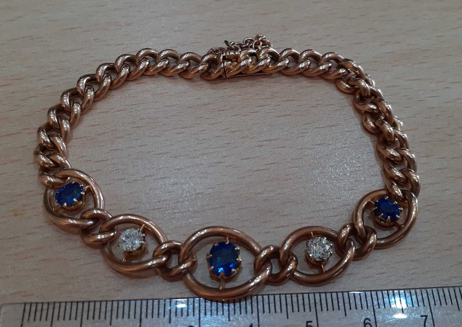 A Sapphire and Diamond Bracelet three graduated oval cut sapphires alternate with two old cut - Image 5 of 5