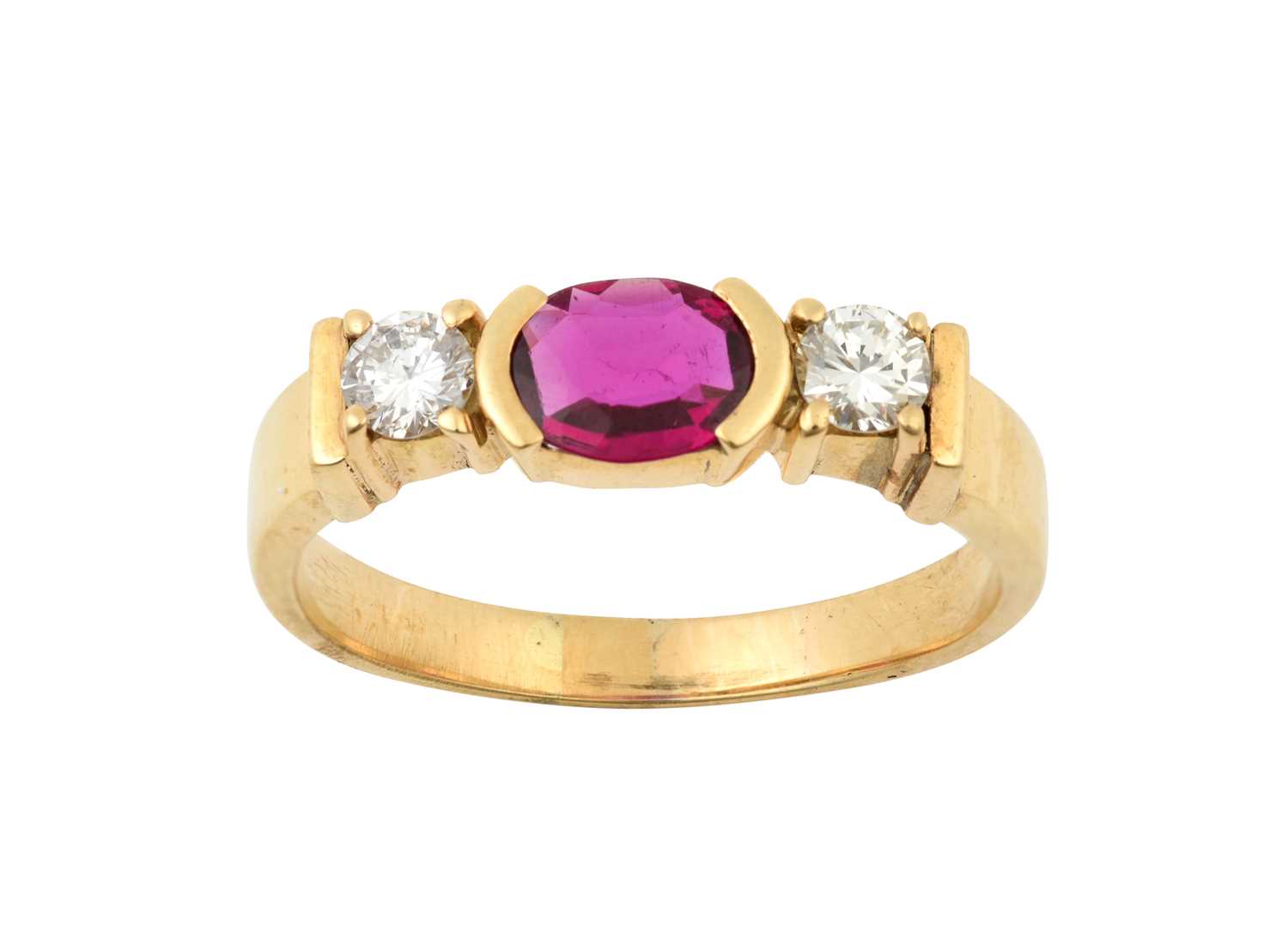 A Synthetic Ruby and Diamond Three Stone Ring the oval cut synthetic ruby in a yellow elongated claw