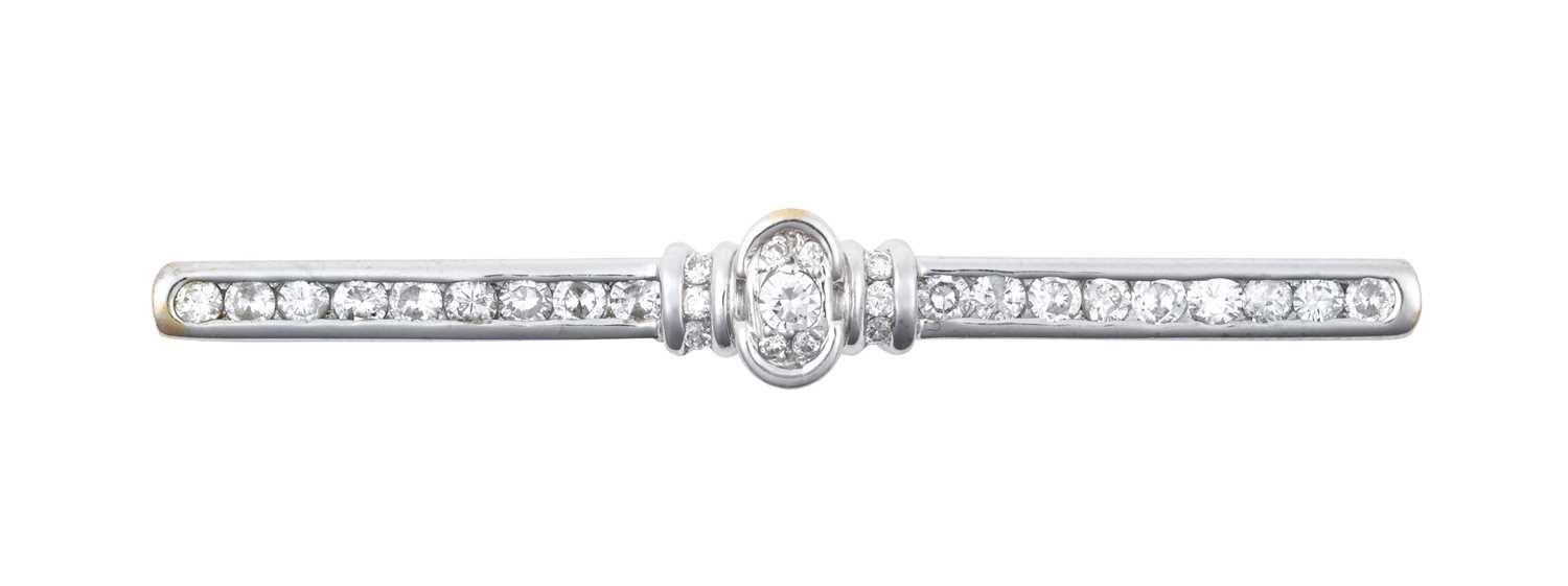 A Diamond Bar Brooch the bar set throughout with round brilliant cut diamonds, with a stepped