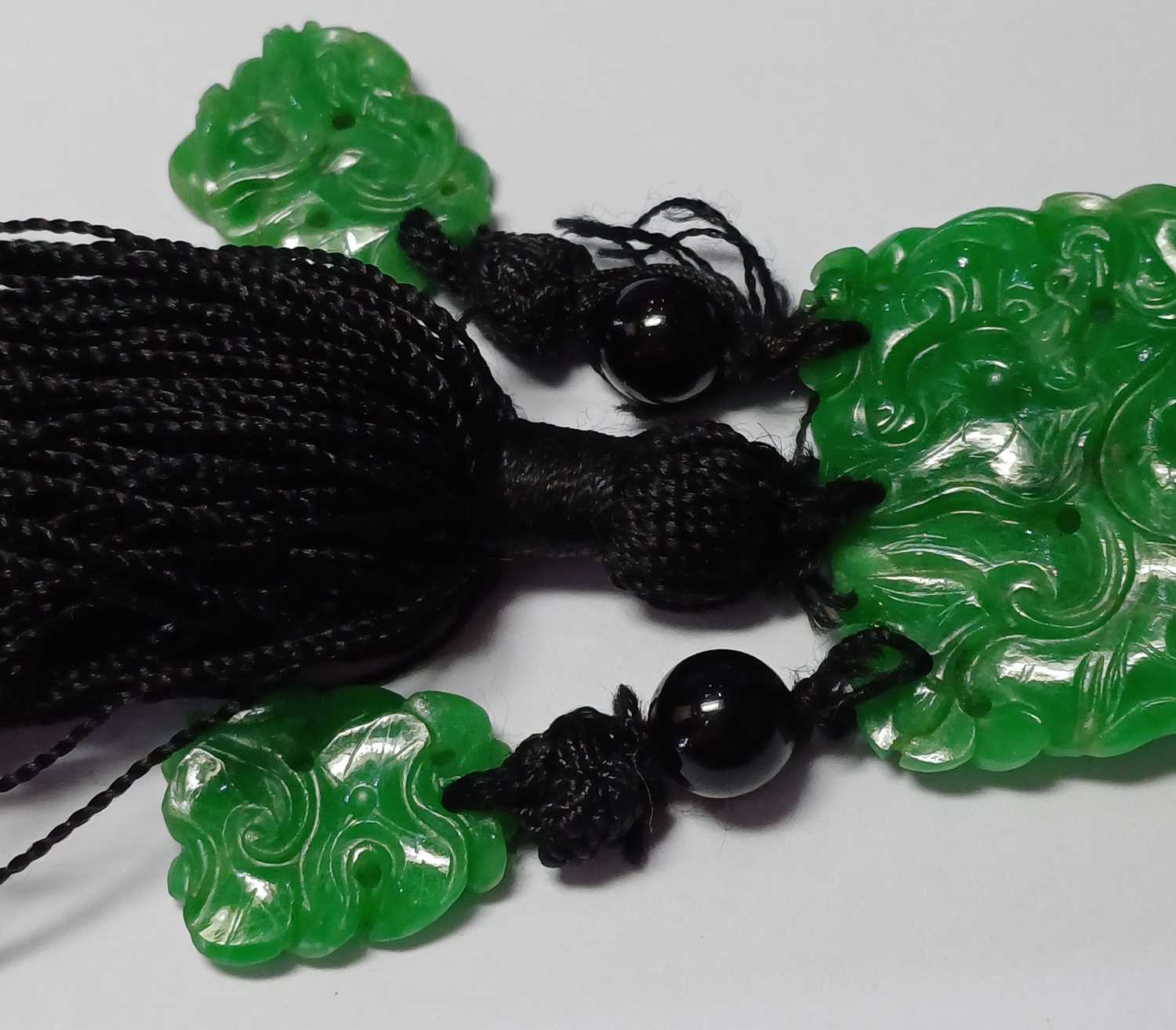 A Jade and Onyx Tassel Necklace an onyx bead suspends a rectangular carved and pierced jade - Image 9 of 16