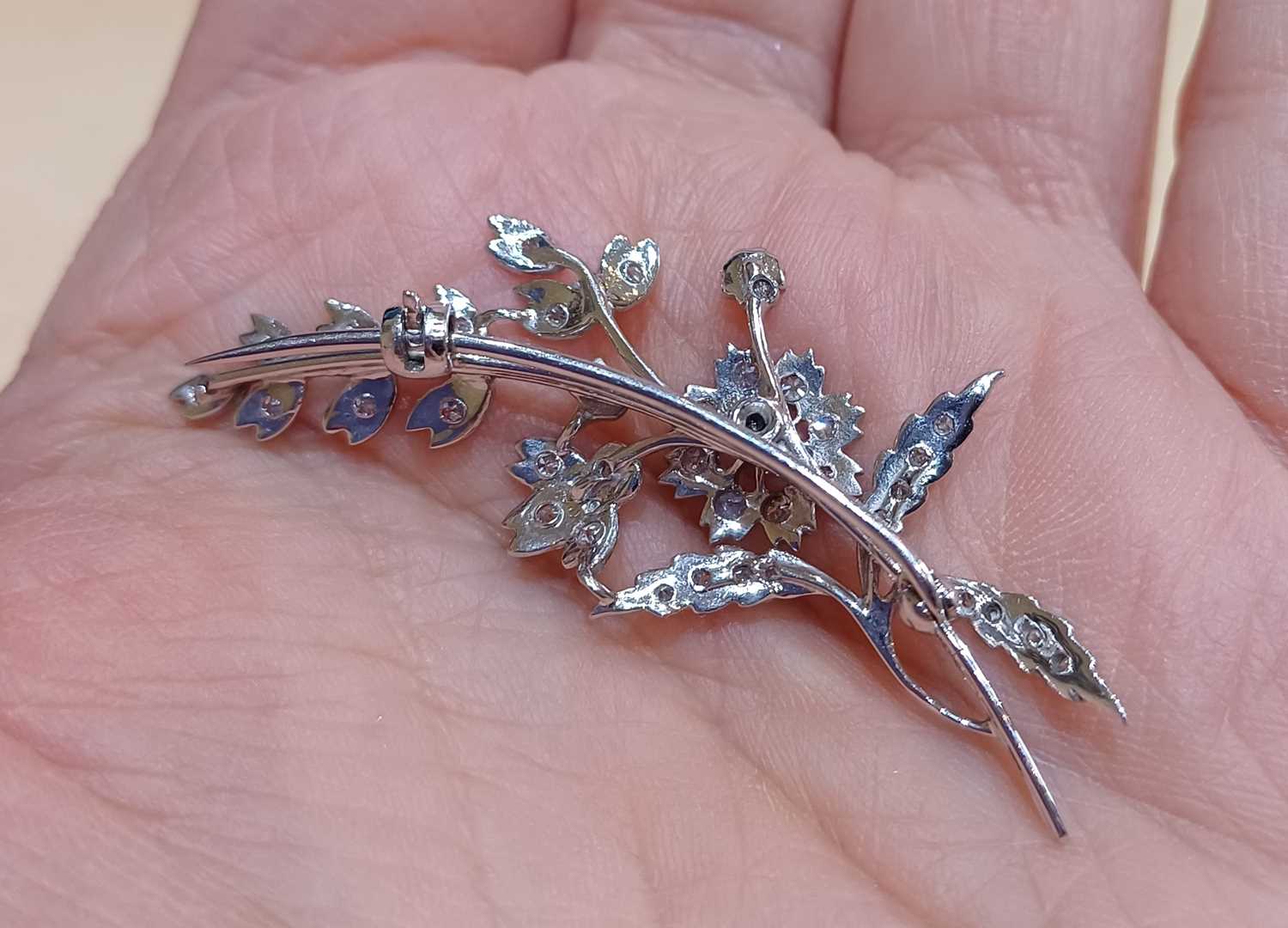 An 18 Carat White Gold Diamond Floral Spray Brooch set throughout with round brilliant cut and - Image 4 of 4