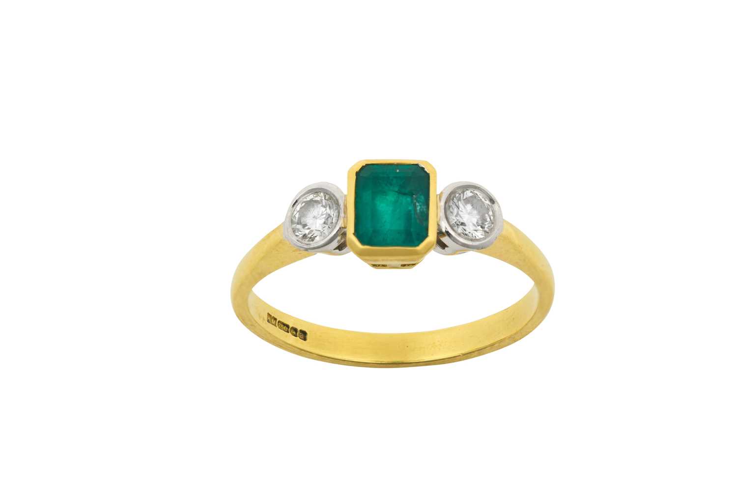 An 18 Carat Gold Emerald and Diamond Three Stone Ring the emerald-cut emerald in a yellow rubbed