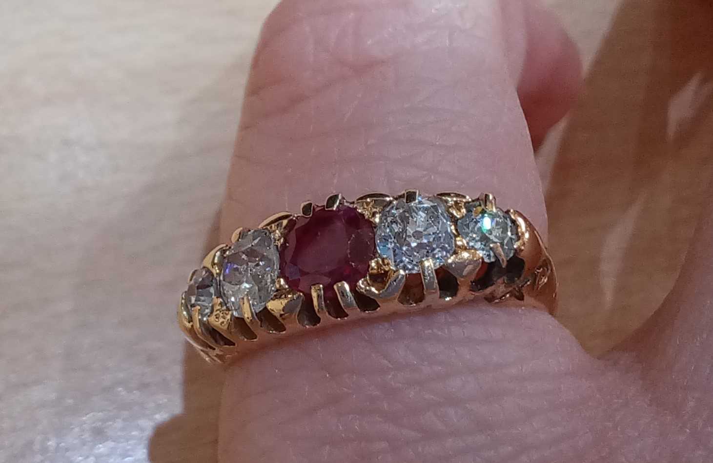 An 18 Carat Gold Ruby and Diamond Five Stone Ring the round cut ruby flanked by graduated old cut - Image 3 of 4