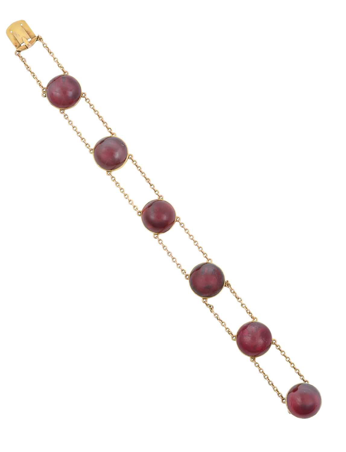 A Late 19th Century Garnet Bracelet six double chain linked round cabochon carbuncle garnets in