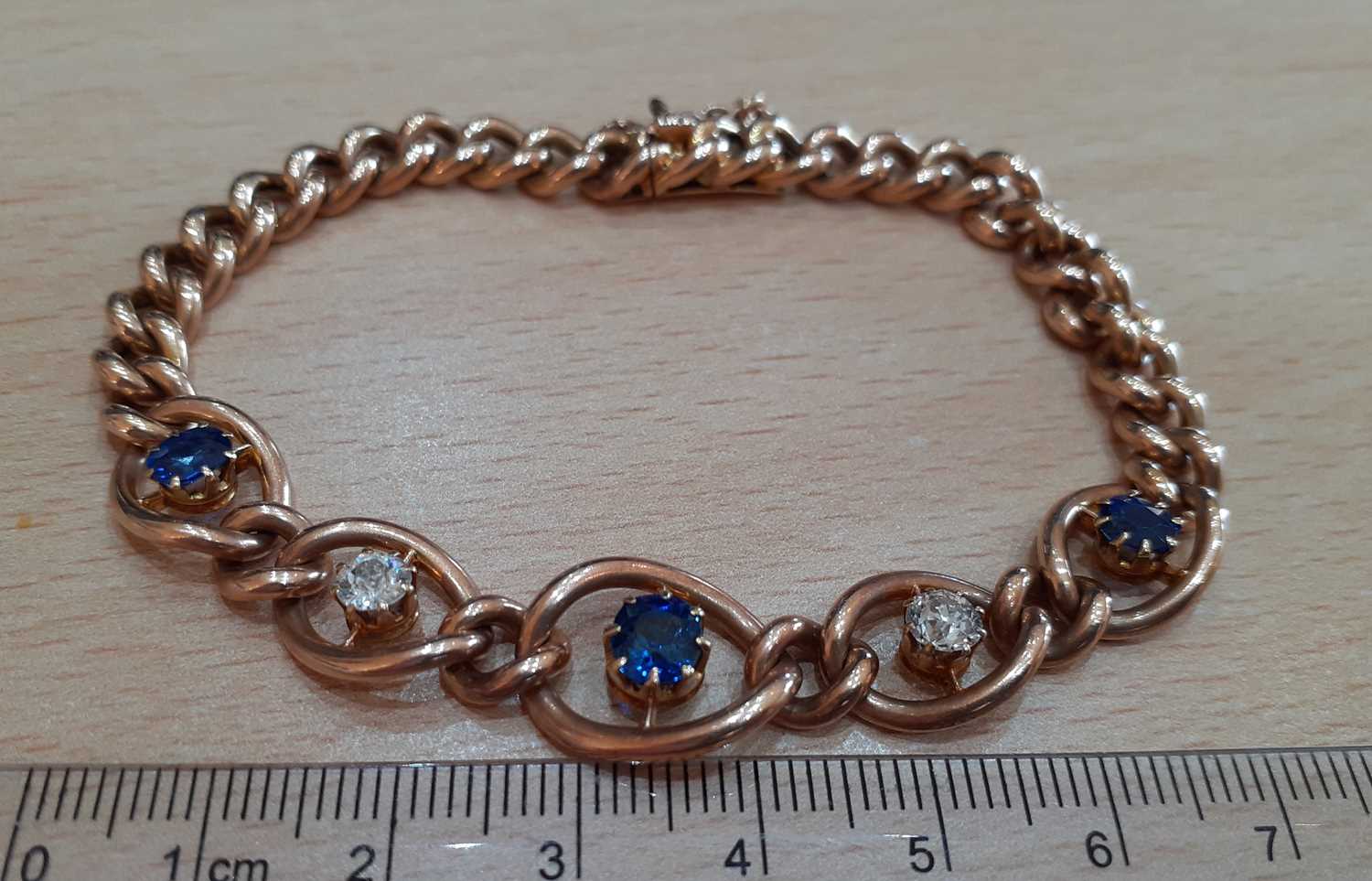 A Sapphire and Diamond Bracelet three graduated oval cut sapphires alternate with two old cut - Image 2 of 5