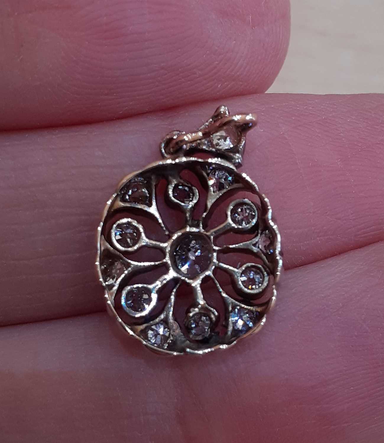 A Diamond Pendant the central old cut diamond to a circular openwork frame set throughout with old - Image 3 of 3