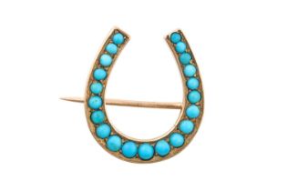 A Victorian Turquoise Brooch the horseshoe motif set throughout with graduated round cabochon