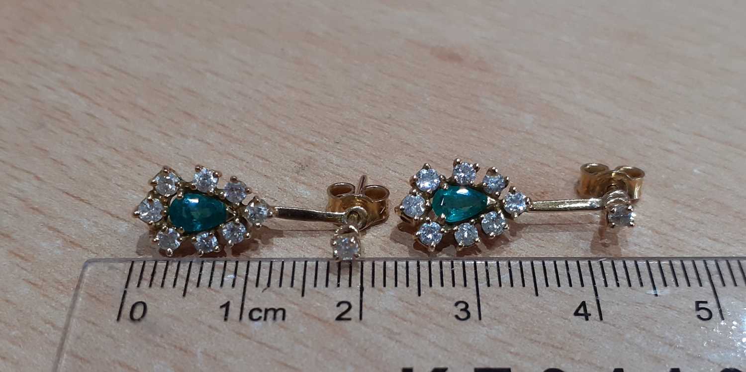 A Pair of 18 Carat Gold Emerald and Diamond Drop Earrings the pear cut emerald within a border of - Image 2 of 4