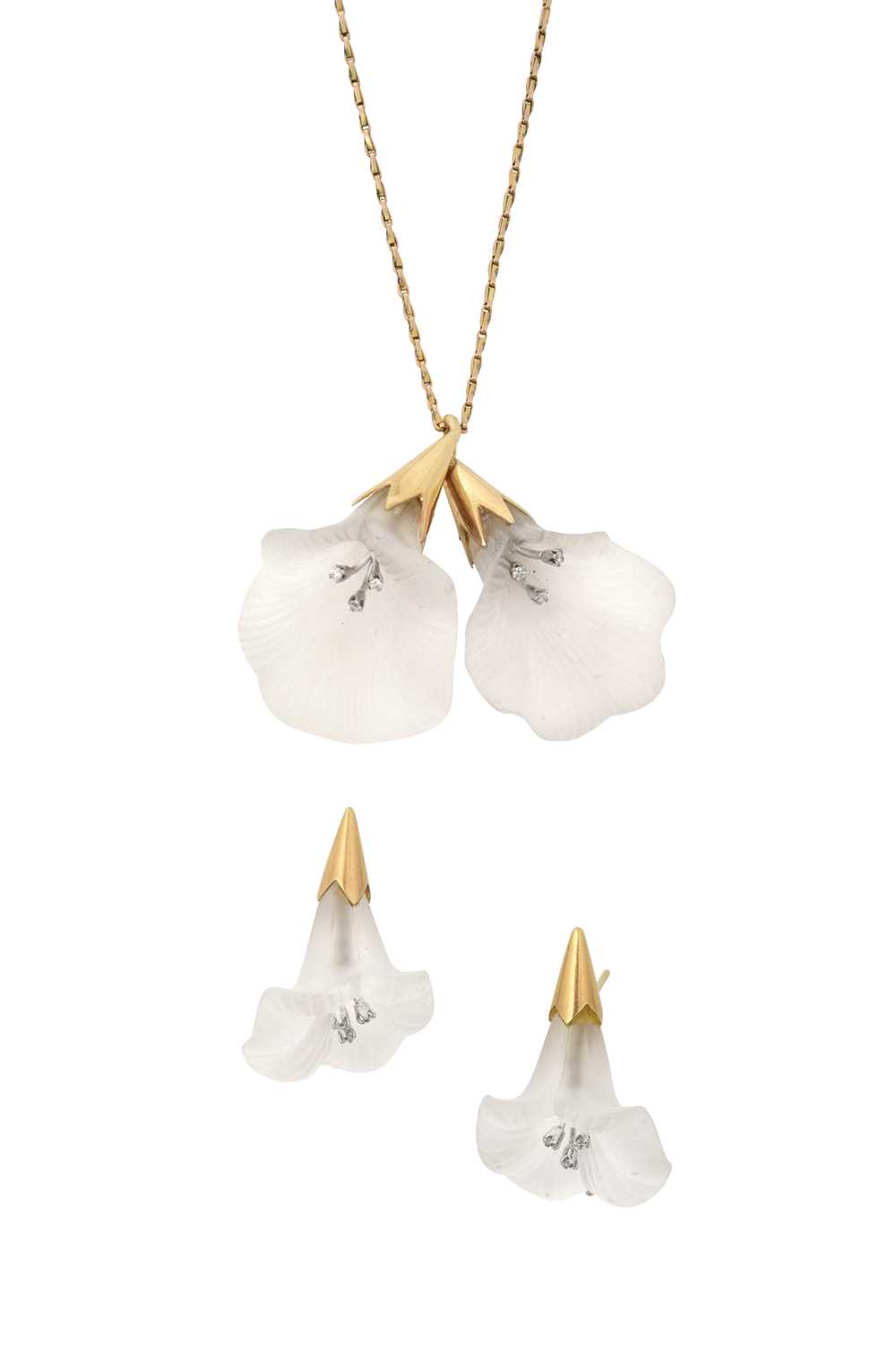 A Rock Crystal and Diamond Pendant and Earring Suite realistically modelled as flowers, the carved