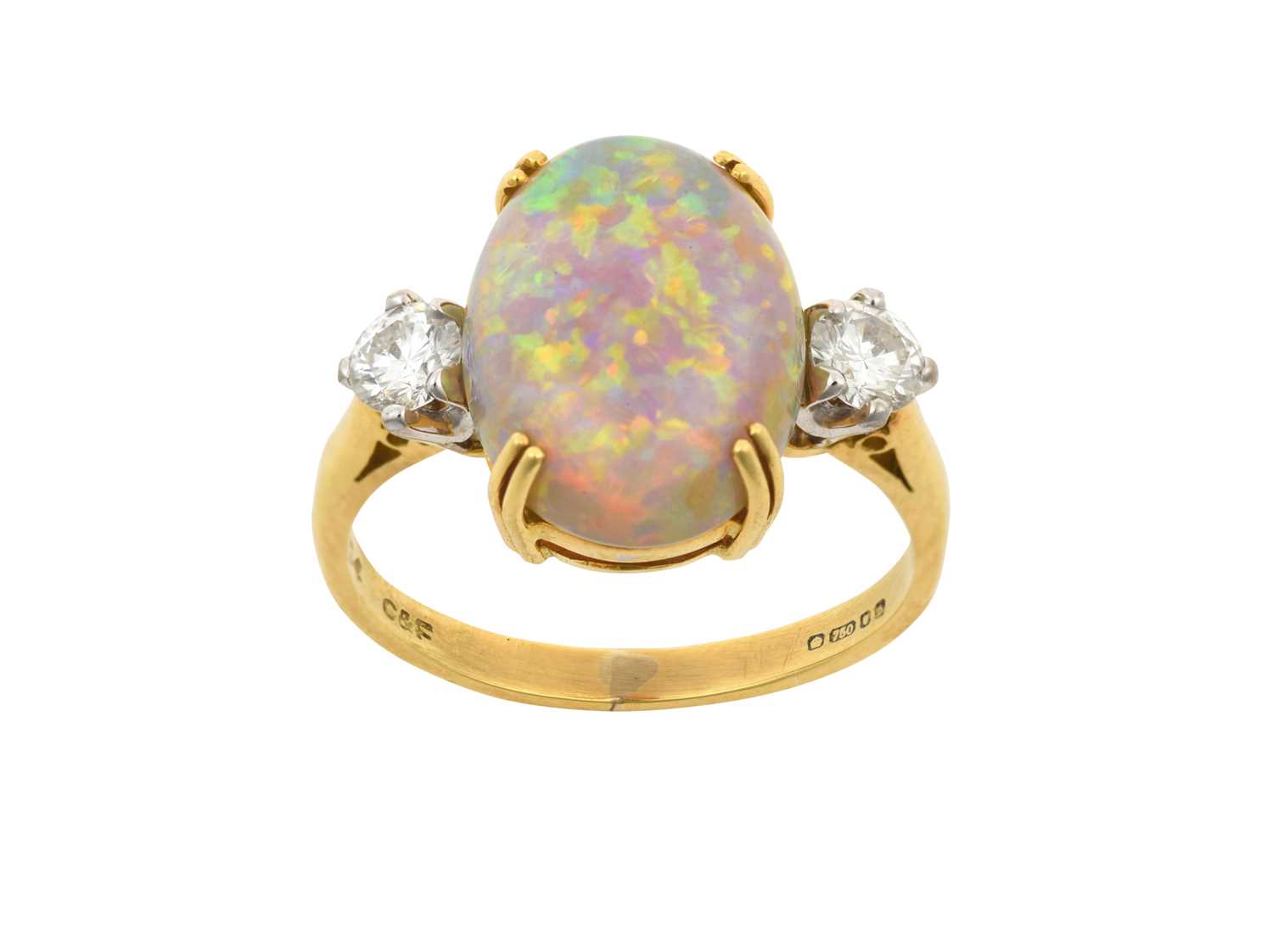 An 18 Carat Gold Opal and Diamond Three Stone Ring the oval cabochon opal in a yellow double claw