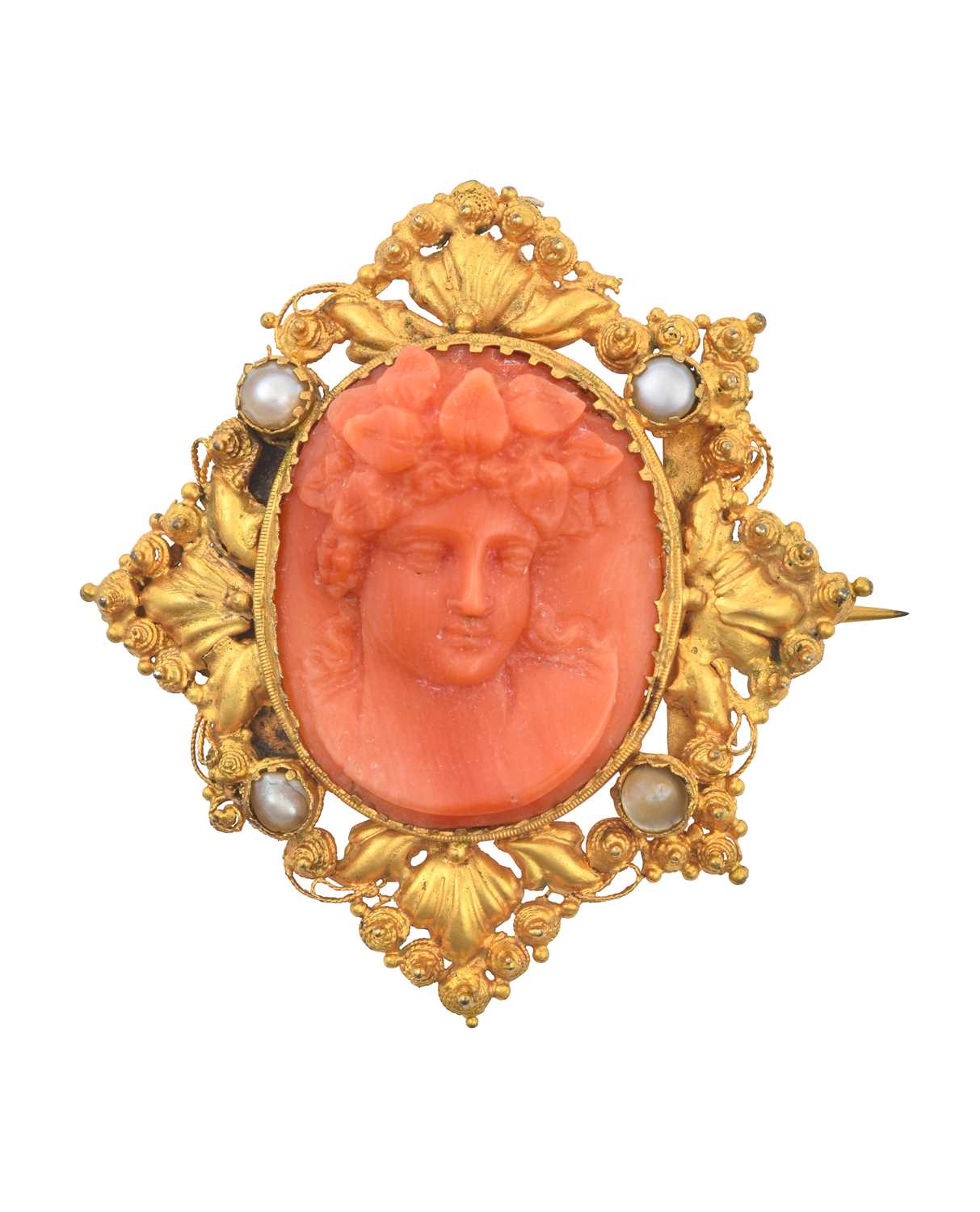 A Late 19th Century Coral and Split Pearl Cameo Brooch the coral carved to depict Bacchus, in a