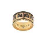 An 18 Carat Gold Enamel Mourning Ring the yellow broad band enamelled in black to read IN MEMORY OF,