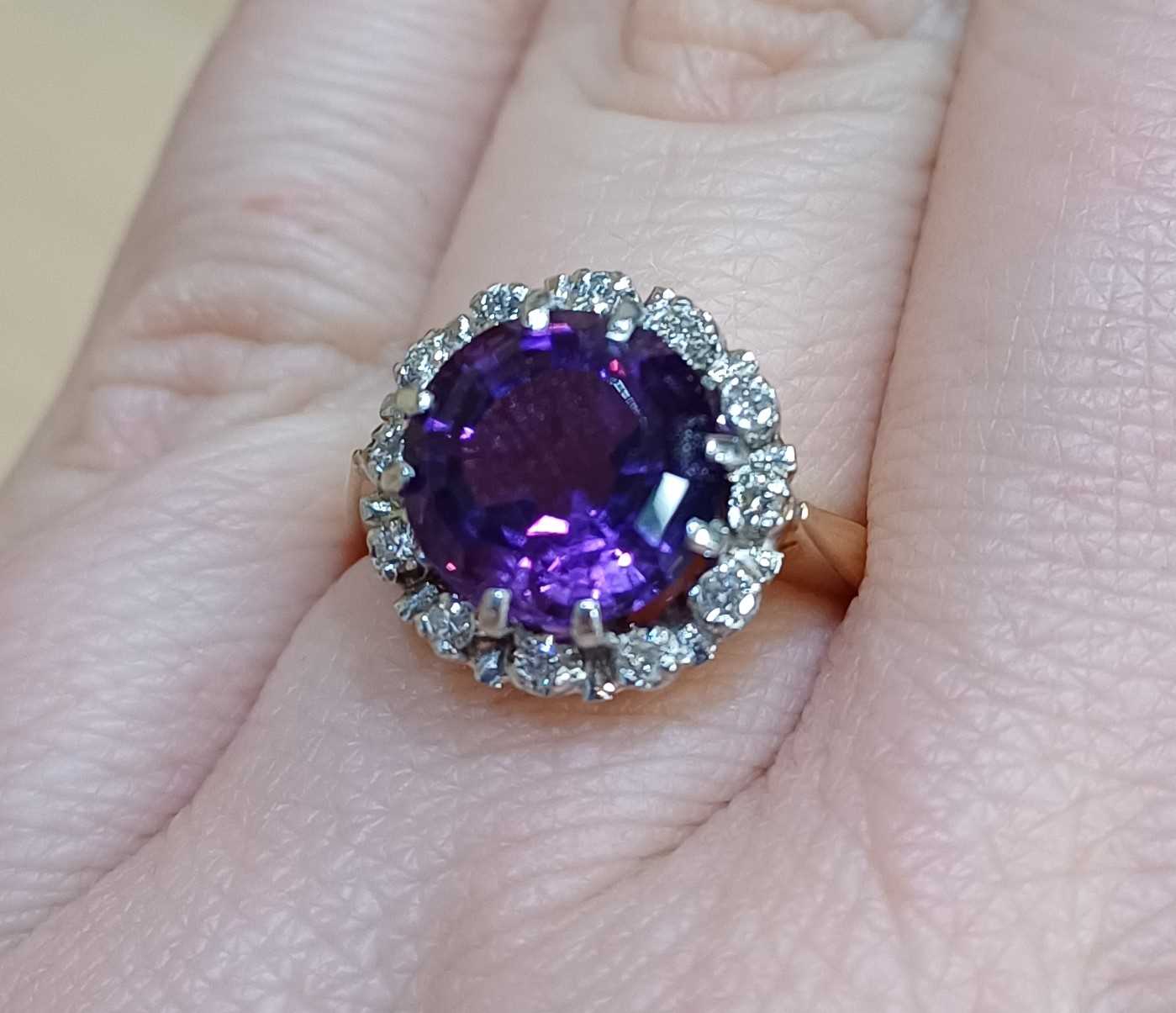 An Amethyst and Diamond Cluster Ring the round cut amethyst within a border of round brilliant cut - Image 2 of 4