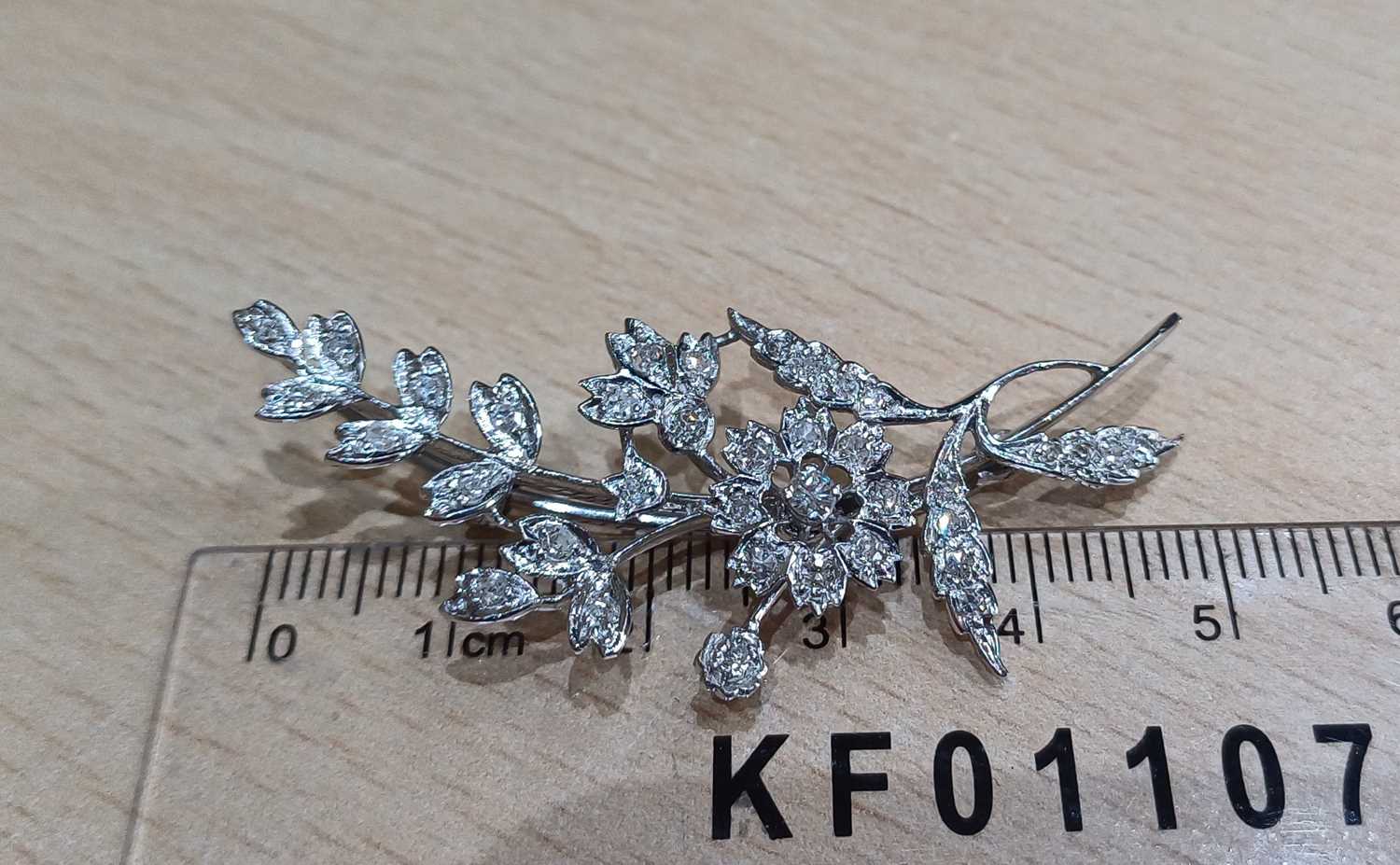 An 18 Carat White Gold Diamond Floral Spray Brooch set throughout with round brilliant cut and - Image 2 of 4