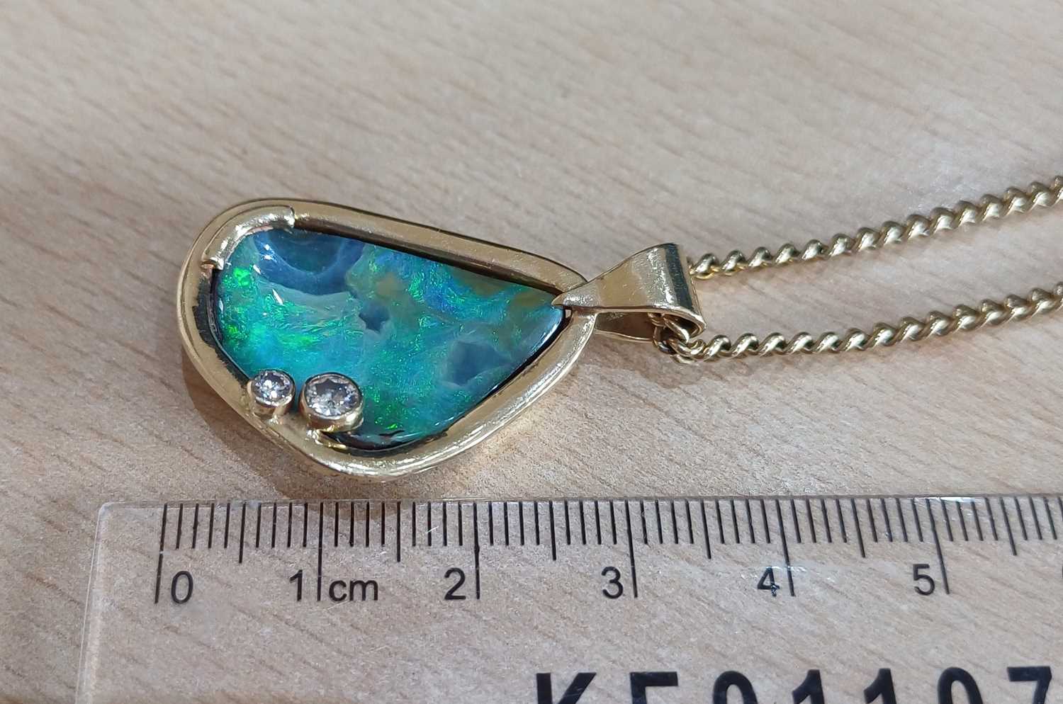 An Opal and Diamond Pendant on Chain the irregular shaped opal plaque decorated with two round - Image 3 of 4