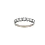 An 18 Carat White Gold Diamond Half Hoop Ring seven round brilliant cut diamonds in claw settings,