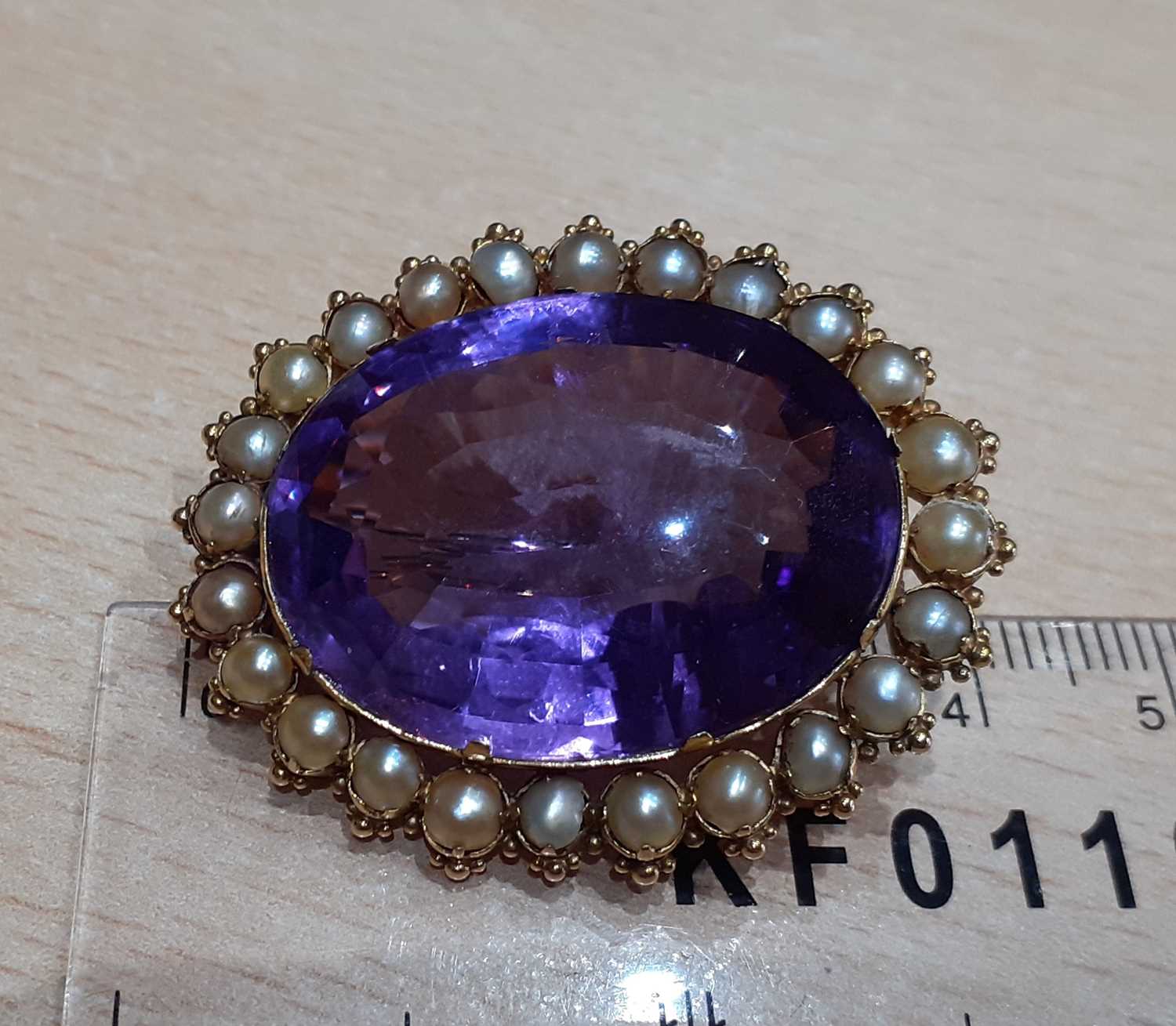 An Amethyst and Split Pearl Brooch the oval cut amethyst within a border of split pearls, in - Image 3 of 4