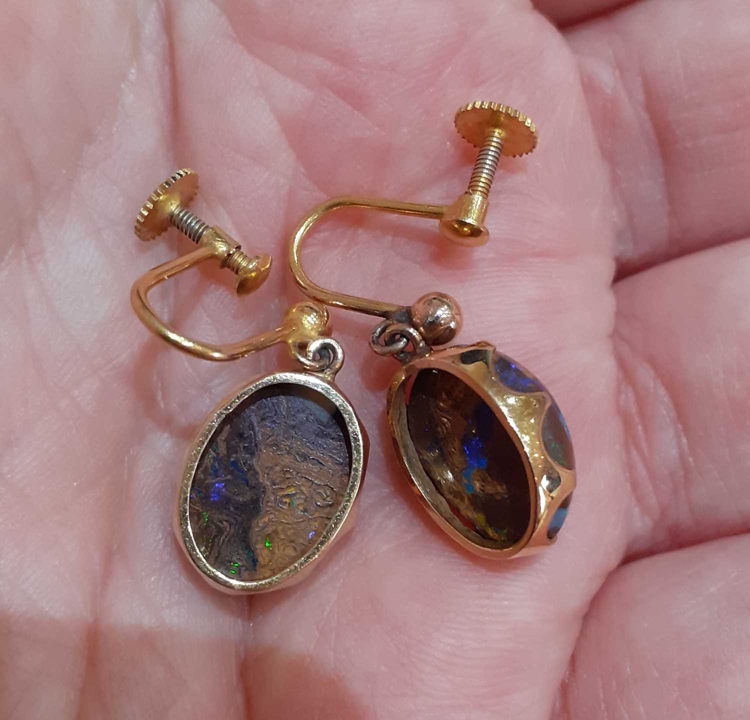 A Pair of Opal Earrings the oval cabochon boulder opals in yellow claw settings, surmounted by a - Image 3 of 4
