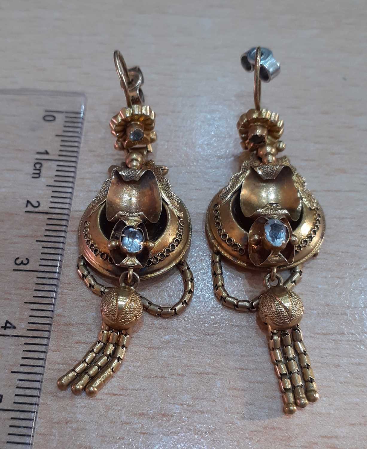 A Pair of Victorian Drop Earrings the round cut colourless stone within a yellow shell motif border, - Image 2 of 3