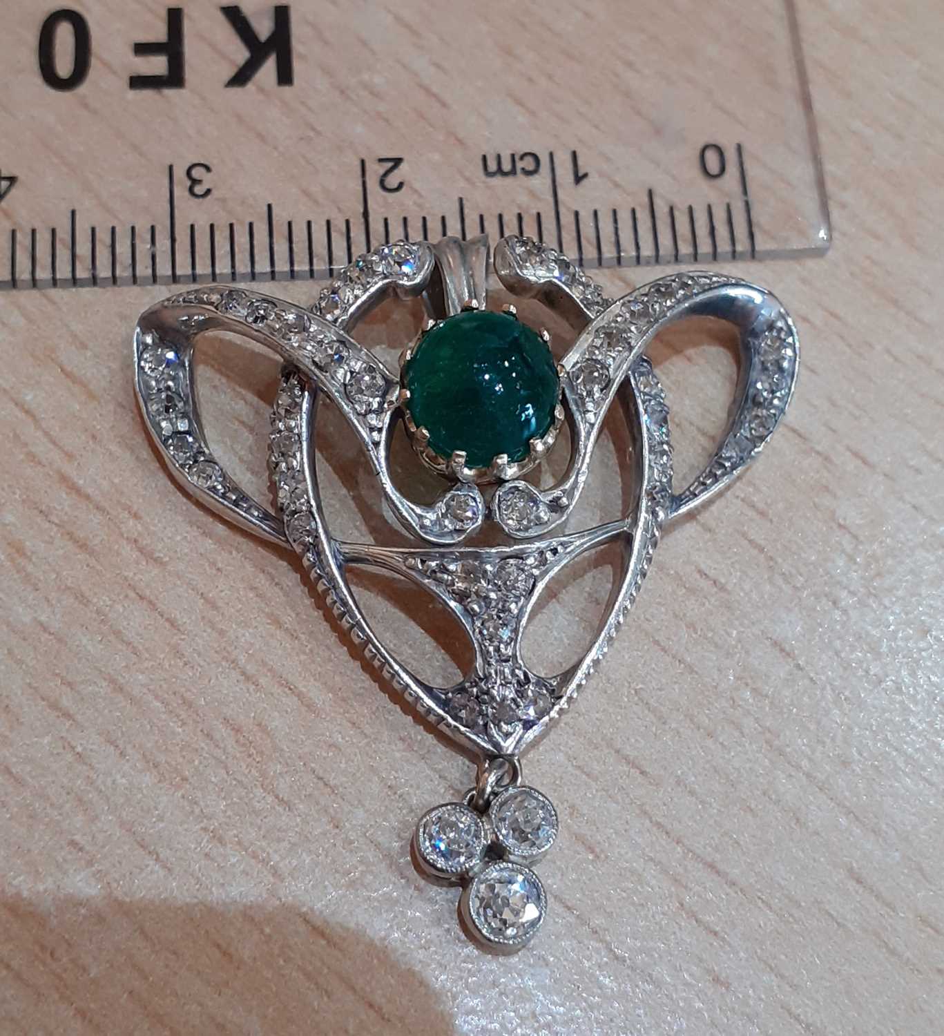 An Emerald and Diamond Pendant of openwork scroll form, set throughout with old cut diamonds, - Image 4 of 4