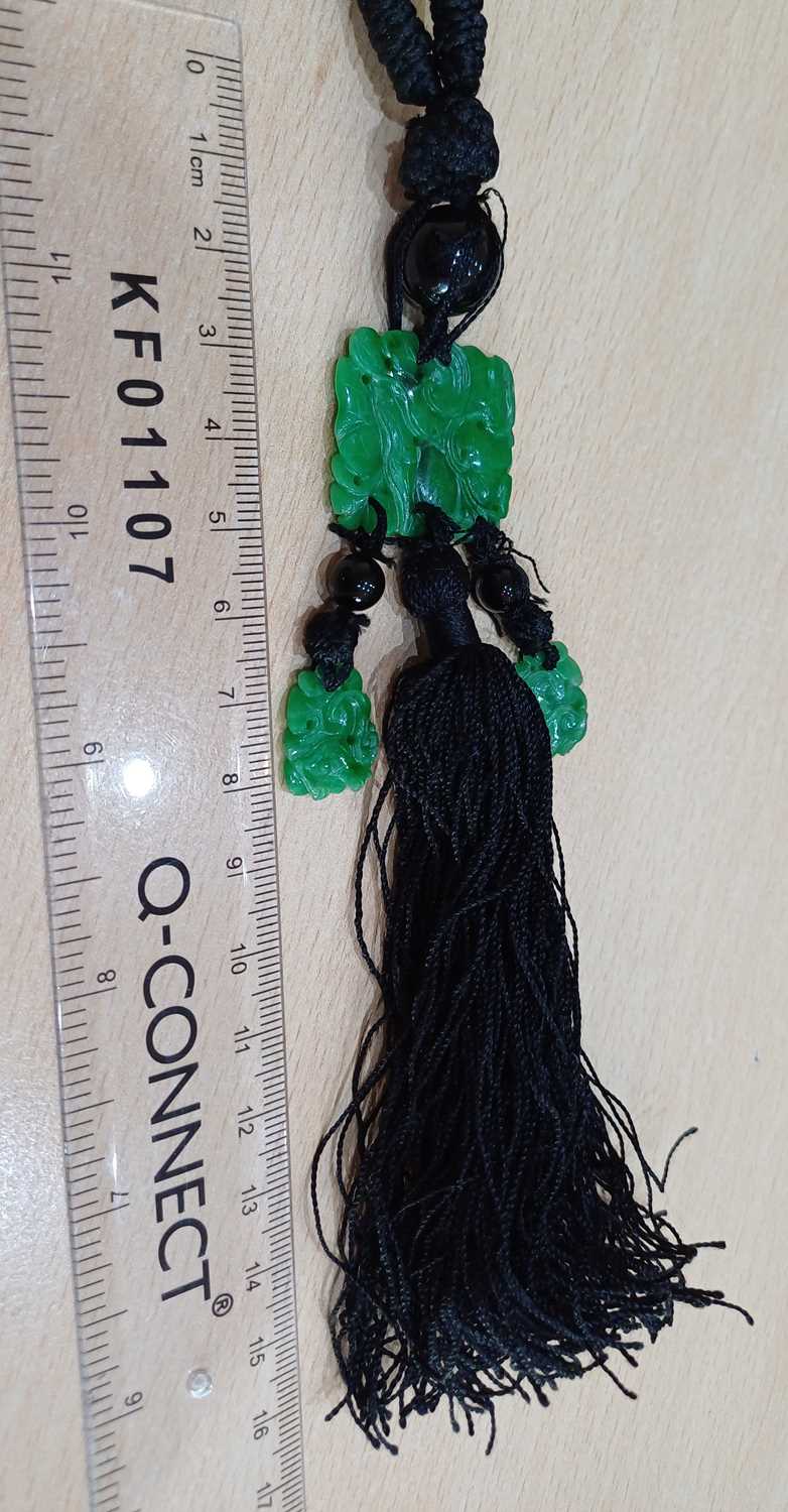 A Jade and Onyx Tassel Necklace an onyx bead suspends a rectangular carved and pierced jade - Image 2 of 16