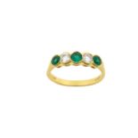 An 18 Carat Gold Emerald and Diamond Five Stone Ring three round cut emeralds alternate with two