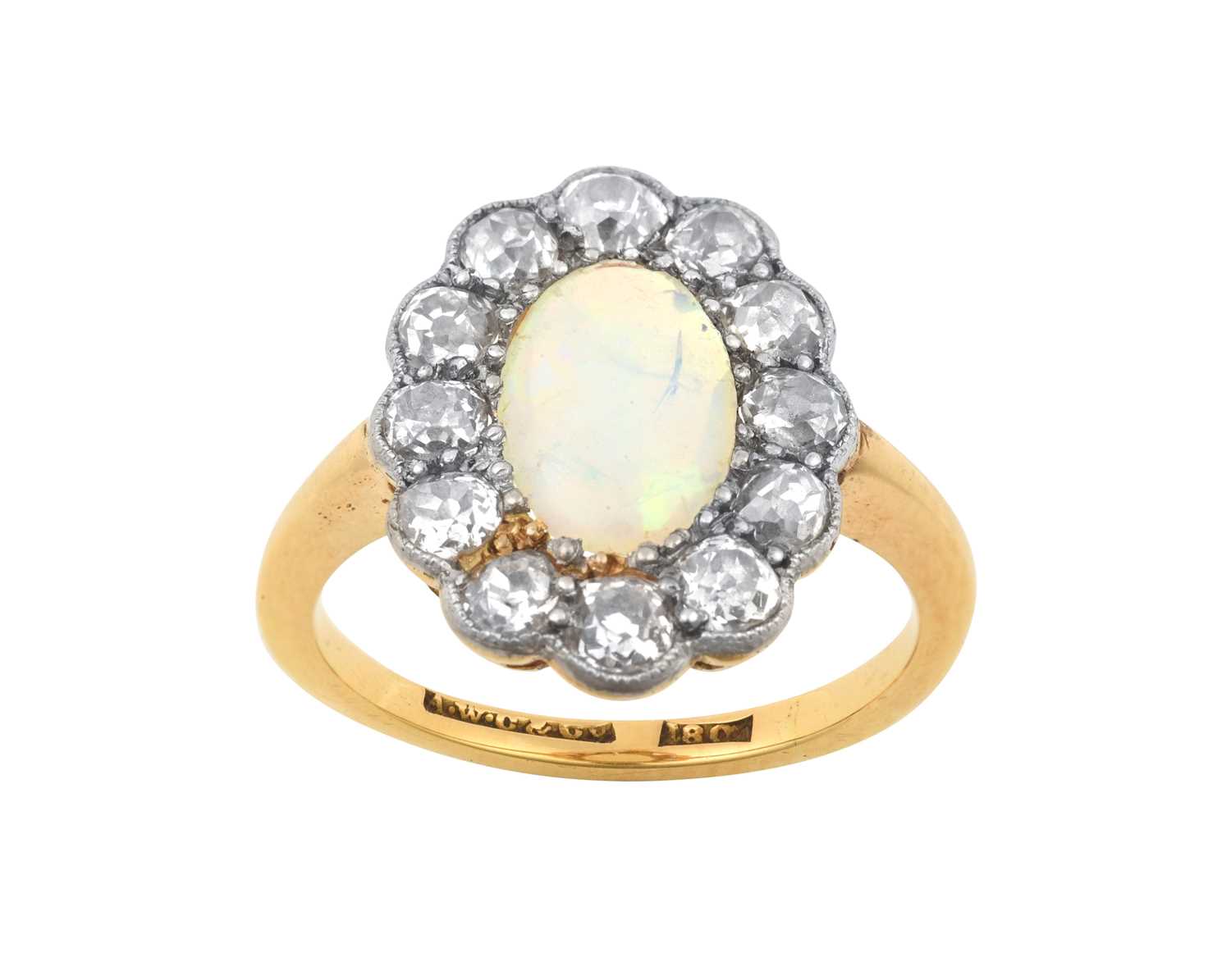 An Opal and Diamond Cluster Ring the oval opal within a border of old cut diamonds, in white