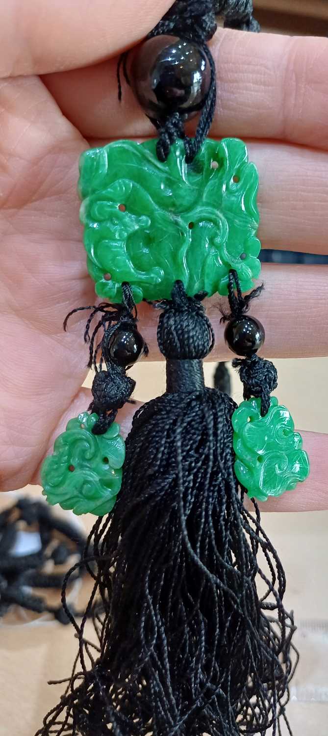 A Jade and Onyx Tassel Necklace an onyx bead suspends a rectangular carved and pierced jade - Image 4 of 16