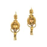 A Pair of Victorian Drop Earrings the round cut colourless stone within a yellow shell motif border,