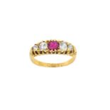 An 18 Carat Gold Ruby and Diamond Five Stone Ring the round cut ruby flanked by graduated old cut