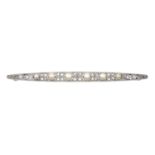 An Edwardian Pearl and Diamond Brooch the tapering bar set throughout with six graduated pearls