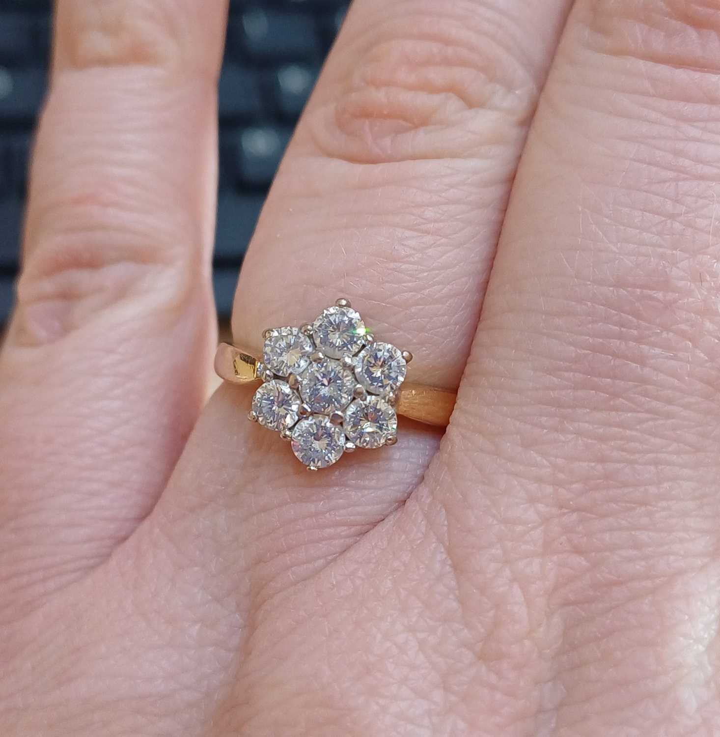 An 18 Carat Gold Diamond Cluster Ring the central raised round brilliant cut diamond within a border - Image 2 of 5