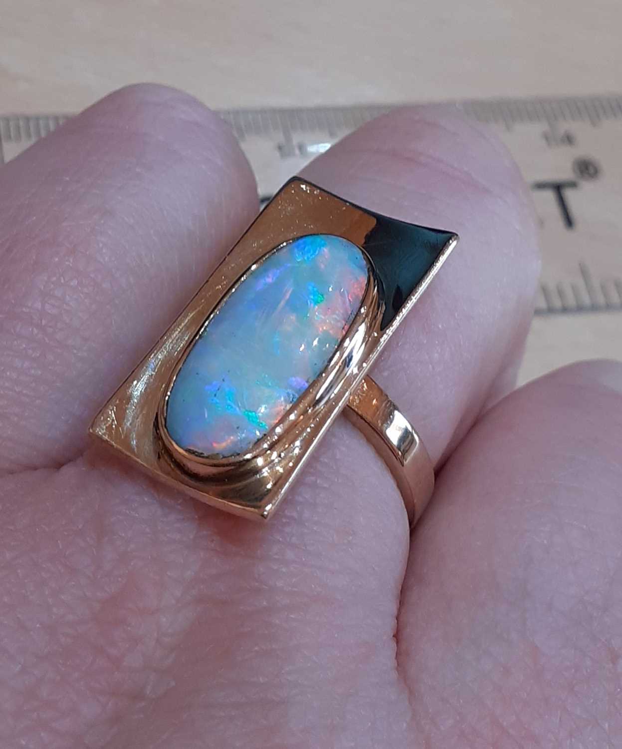 An Opal Ring the yellow plain polished rectangular plaque overlaid with an oval opal plaque, in a - Image 2 of 5
