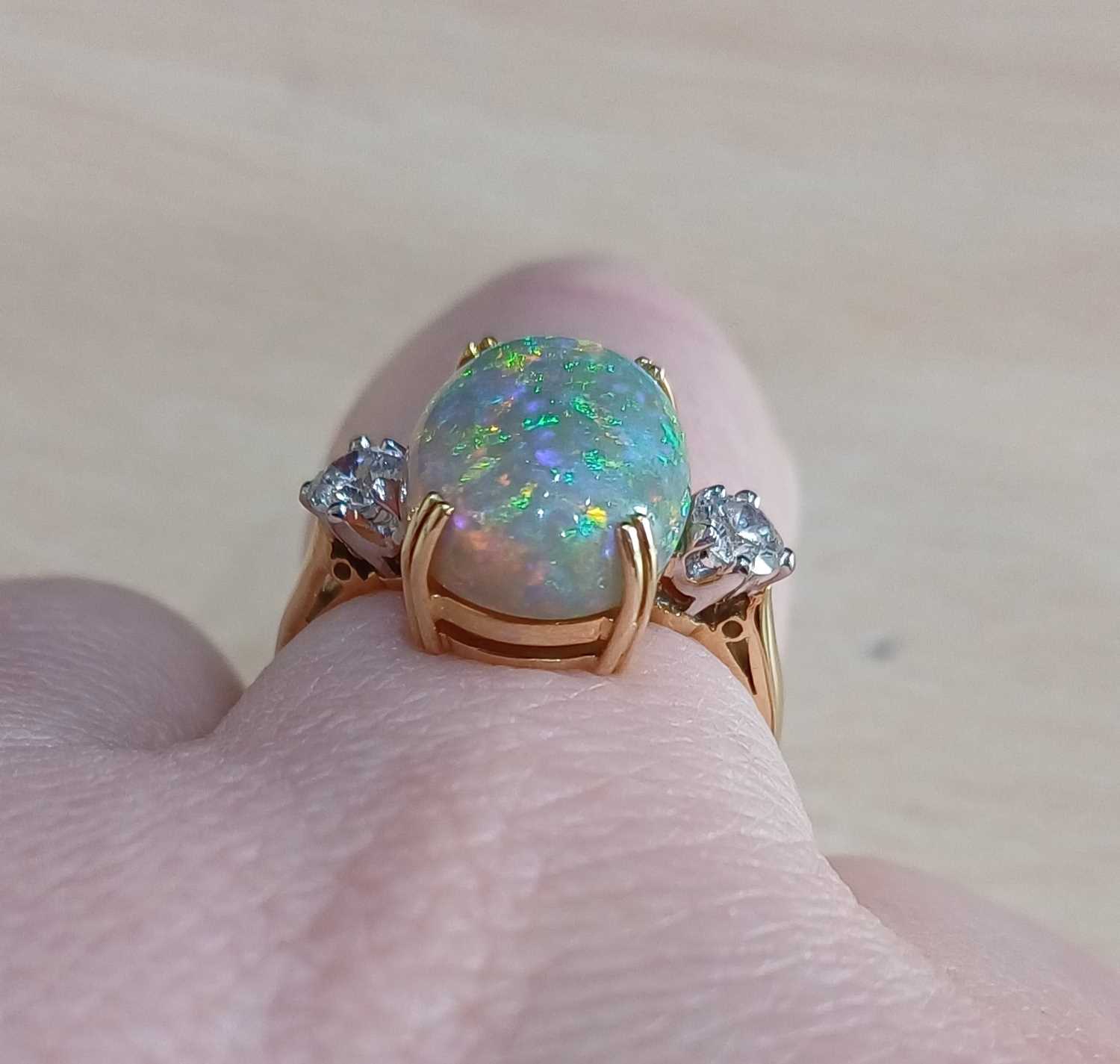 An 18 Carat Gold Opal and Diamond Three Stone Ring the oval cabochon opal in a yellow double claw - Image 4 of 4