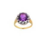 An Amethyst and Diamond Cluster Ring the round cut amethyst within a border of round brilliant cut