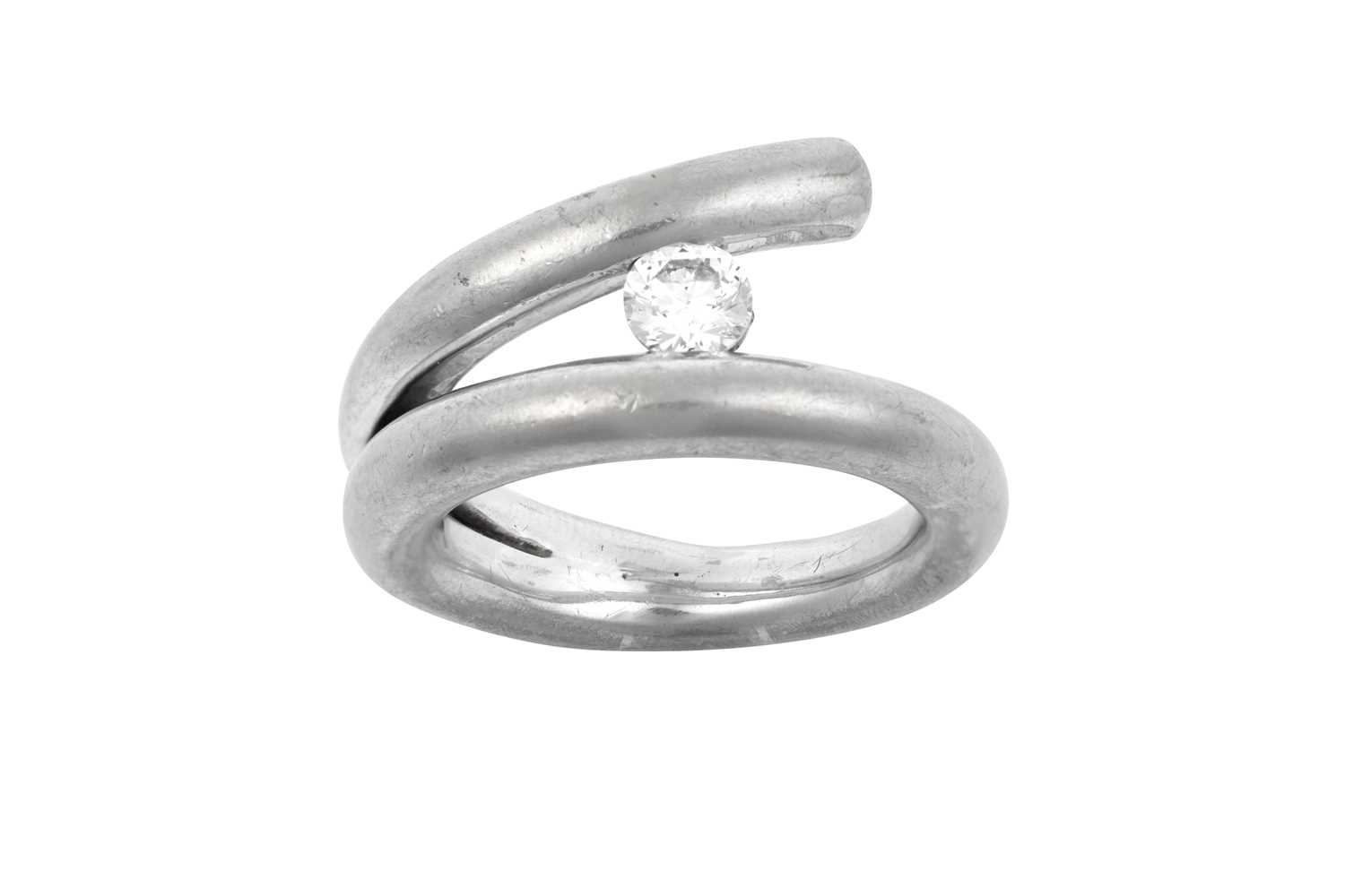 An 18 Carat White Gold Diamond Crossover Ring the round brilliant cut diamond in a white tension