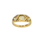 An 18 Carat Gold Chrysoberyl and Diamond Ring three graduated cushion cut chrysoberyls in yellow