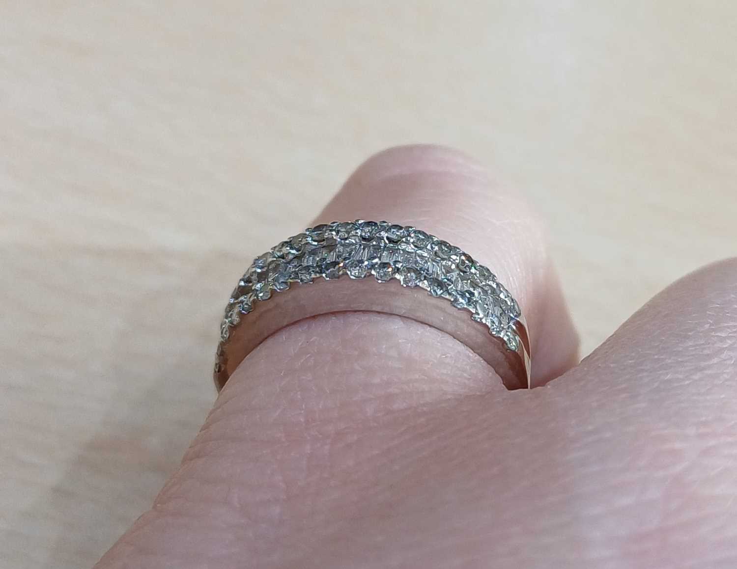 A Diamond Half Hoop Ring a row of tapered baguette cut diamonds within two rows of round brilliant - Image 3 of 4