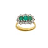 An 18 Carat Gold Emerald and Diamond Triple Cluster Ring three graduated oval cut emeralds within