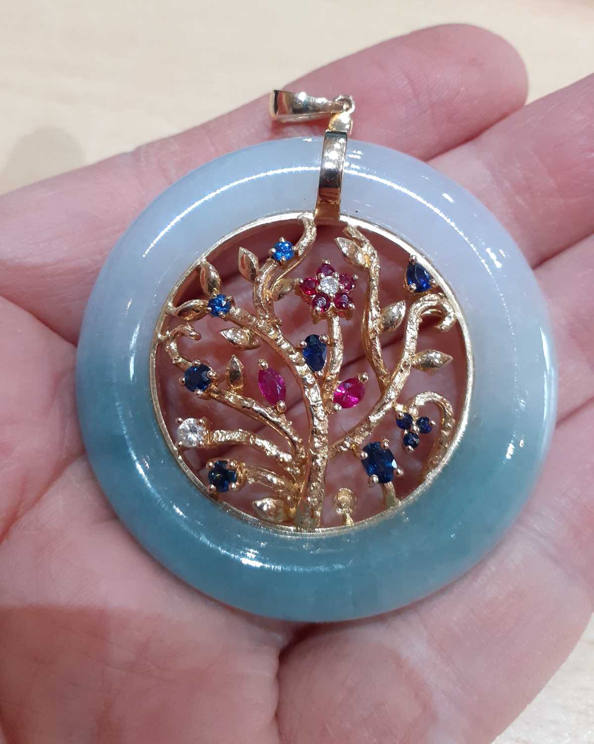A Ruby, Sapphire, Diamond and Jade Pendant the circular jade frame with a yellow foliate scene - Image 3 of 4