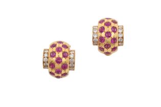 A Pair of Ruby and Diamond Cuff Earrings three rows of round cut rubies in yellow star settings,