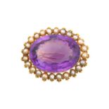 An Amethyst and Split Pearl Brooch the oval cut amethyst within a border of split pearls, in